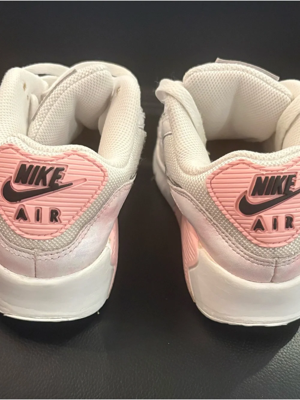 Nike White Sneakers with Light Pink Accents and Black Swoosh